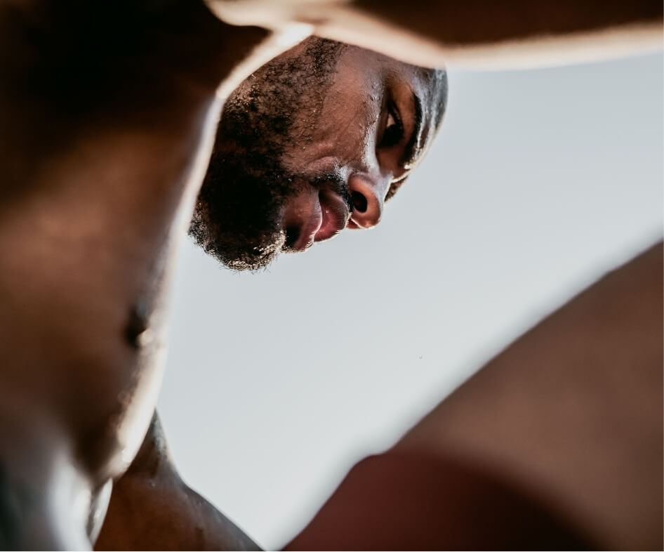 low-angle-portrait-of-sweaty-african-runner-restin-2025-01-09-06-16-46-utc (1)